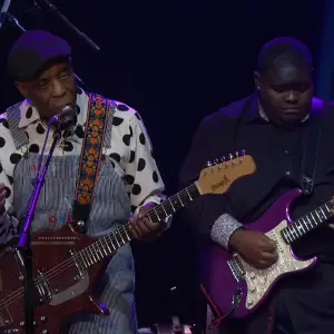 Christone "Kingfish" Ingram playing guitar, inspired by legendary blues musicians such as Buddy Guy and Jimi Hendrix